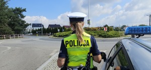 Zdjęcie przedstawia zabezpieczenie wyścigu kolarskiego.